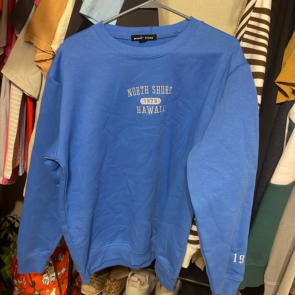 Blue sweater.